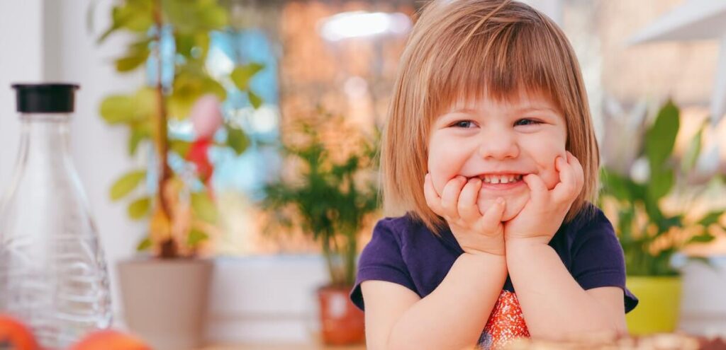 smiling child donate to DBA uk and make a difference